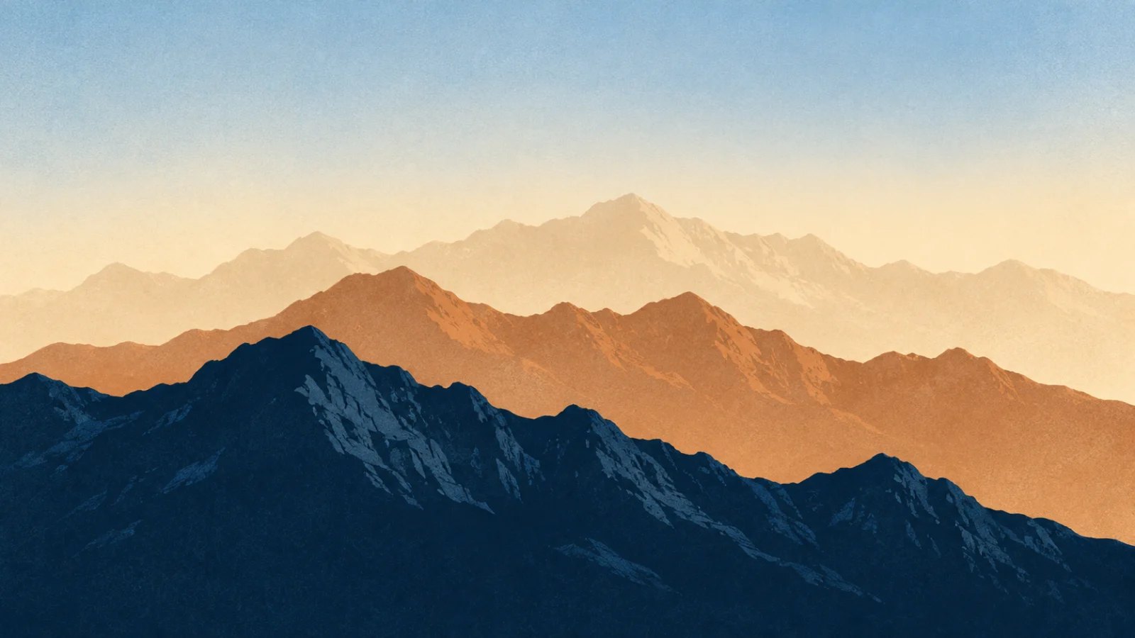Layered mountain ridges fading from crisp navy foreground to a pale distant horizon
